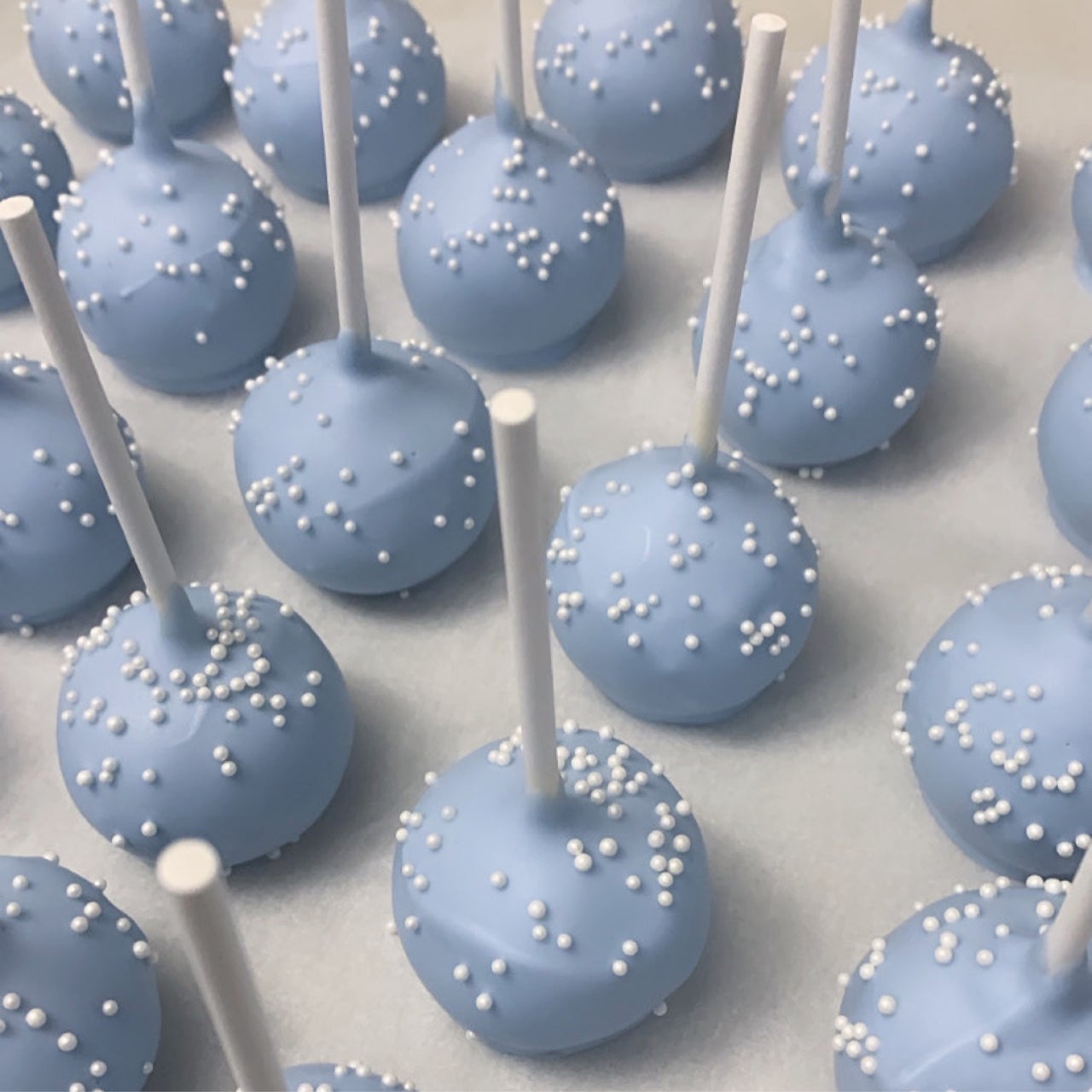 Ube-flavored cake pops in purple tones